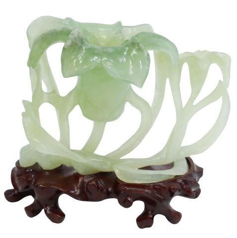 Appraisal: Chinese carved green hardstone depicting naturalistic floral design rising on