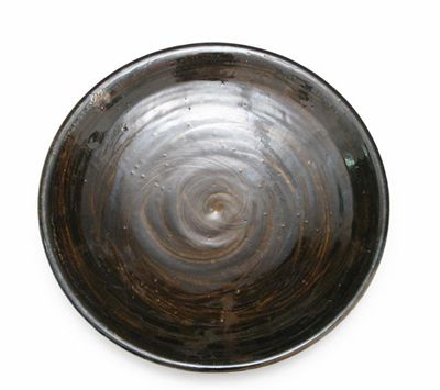 Appraisal: A large Malcolm Pepper stoneware charger covered in a brushed