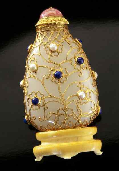 Appraisal: Chinese Qing gold filigree over white jade snuff International shipping