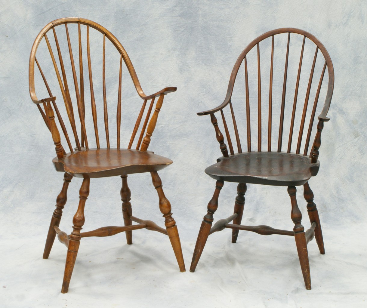 Appraisal: continuous arm Windsor chairs one with brace back has replaced