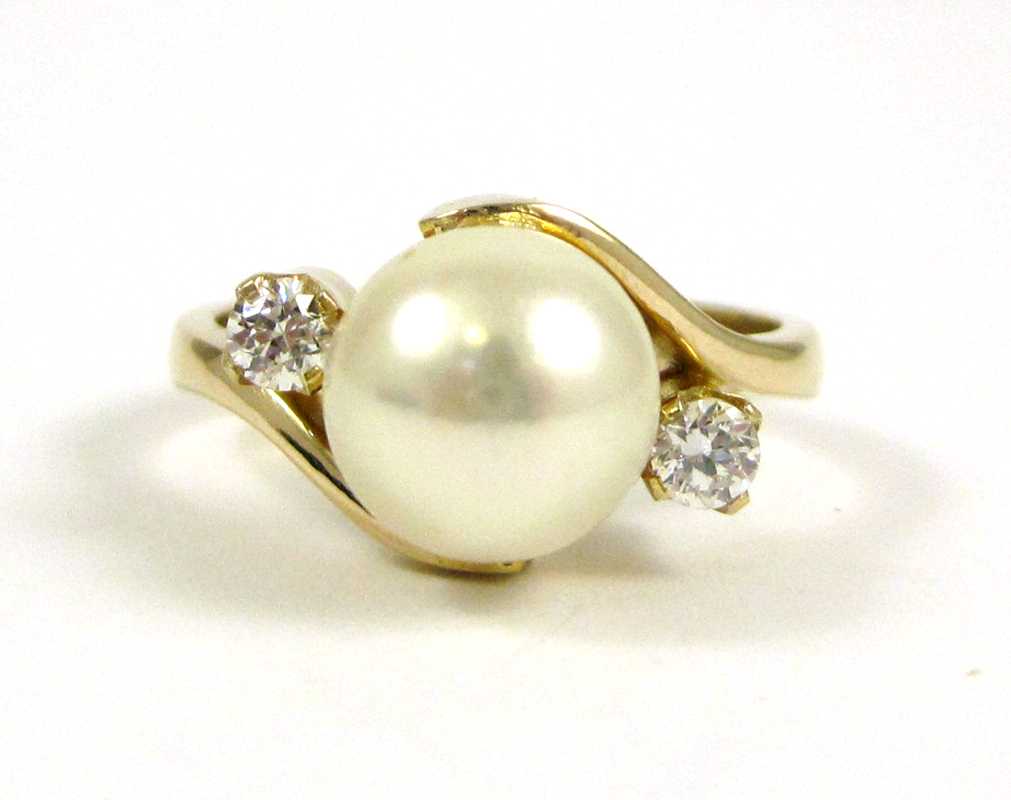 Appraisal: PEARL DIAMOND AND FOURTEEN KARAT GOLD RING with a round