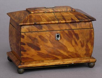 Appraisal: REGENCY METAL-MOUNTED BOMBE TORTOISESHELL TEA CADDY The flattened dome hinged