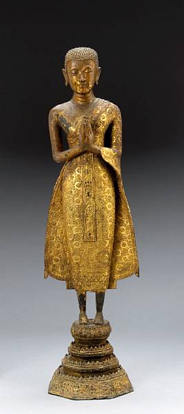 Appraisal: A gilt lacquered bronze attendant to the Buddha Bangkok Period