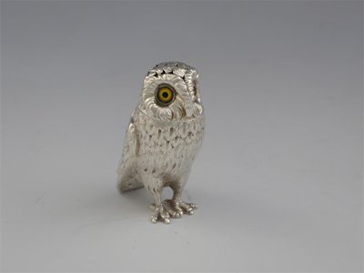 Appraisal: A Victorian novelty owl pepperette with yellow and black glass