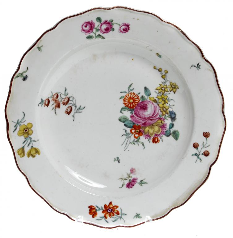 Appraisal: A CHELSEA PLATE enamelled with a loose bouquet with principal