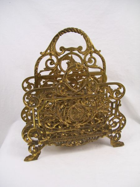 Appraisal: Bradley Hubbard Magazine Holder Cast iron gold finish magazine rack