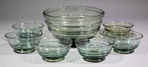 Appraisal: A Whitefriars green tinted and moulded glass bowl ins diameter