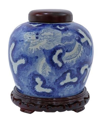 Appraisal: Chinese blue and white porcelain lidded jar with dragon design