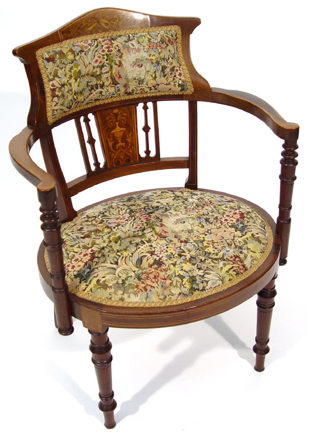 Appraisal: Victorian mahogany nursing chair the back inlaid with musical instruments