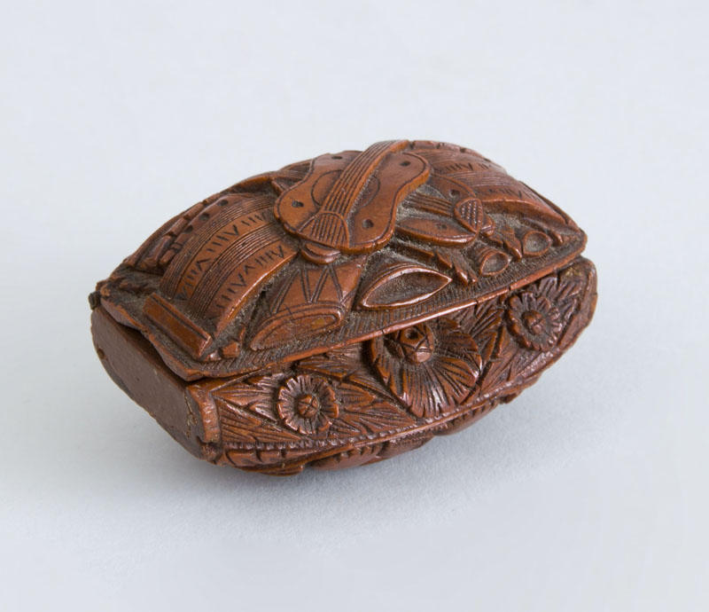 Appraisal: CONTINENTAL CARVED WOOD SNUFF BOX The hinged lid with viola