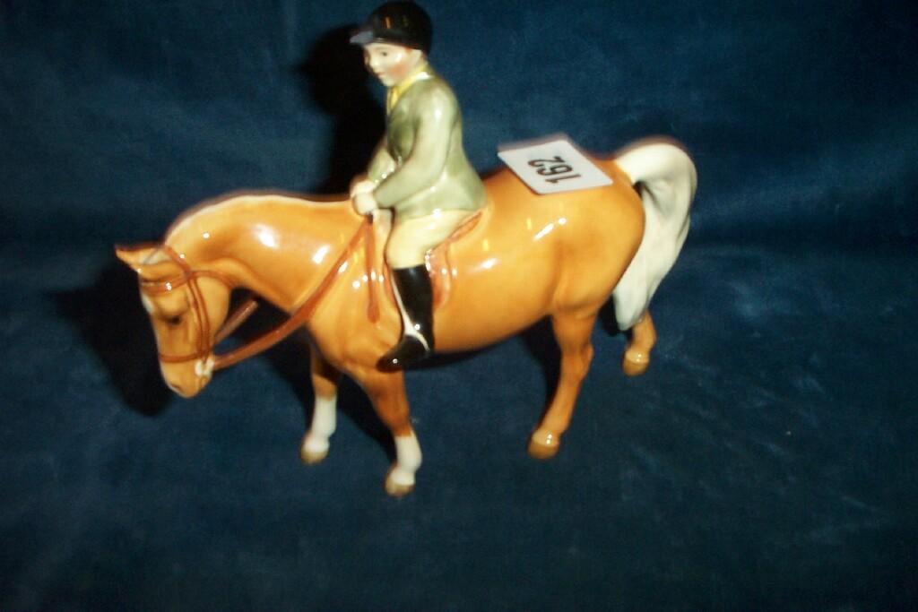 Appraisal: A Beswick model of a boy in a green jacket