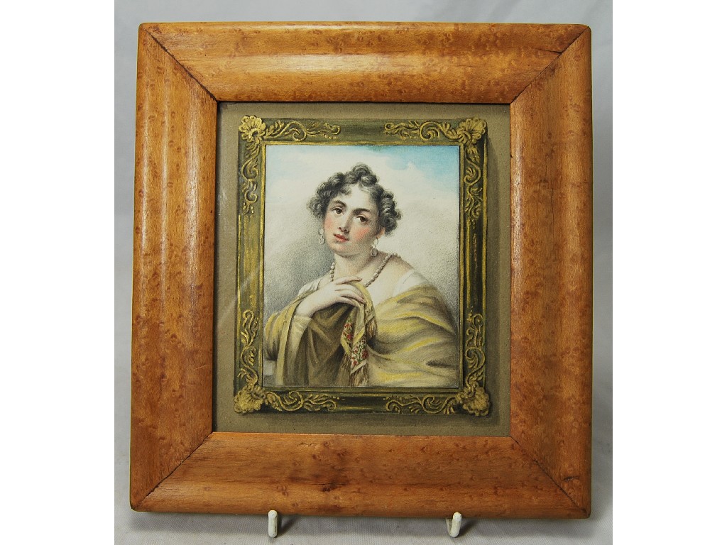 Appraisal: A th century watercolour miniature of a young lady in