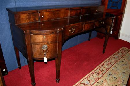 Appraisal: A George III mahogany inverted breakfront sideboard the shaped top