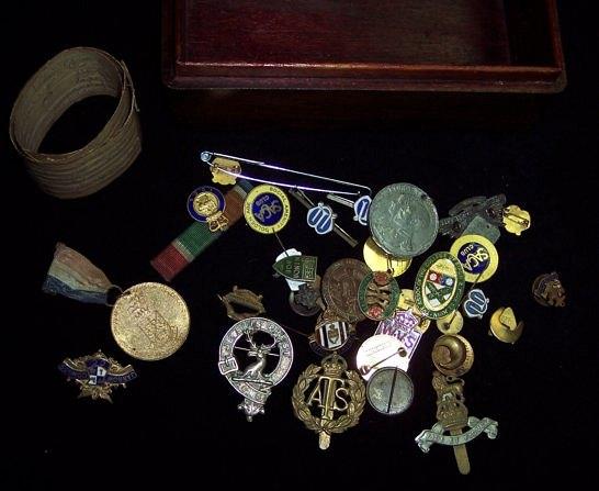 Appraisal: A collection of sundries including cap badges Royal commemorative medallions