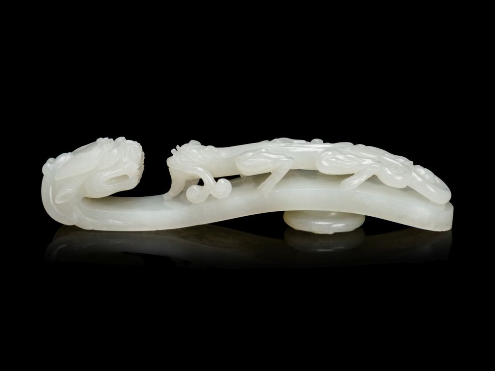 Appraisal: A Large and Finely Carved White Jade 'Chilong' Belt Hook