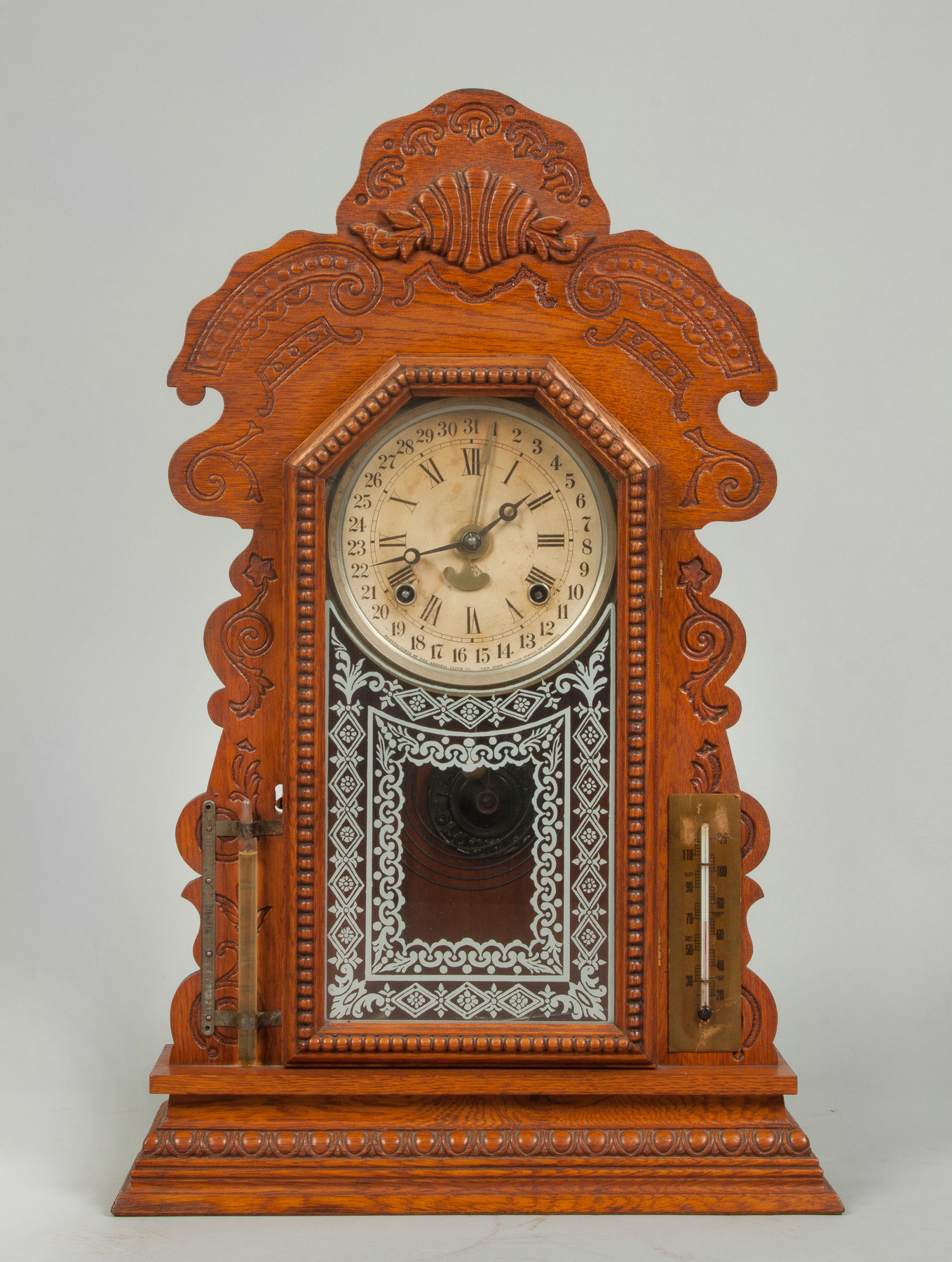 Appraisal: Ansonia Calendar Shelf Clock Pressed oak case with thermometer barometer