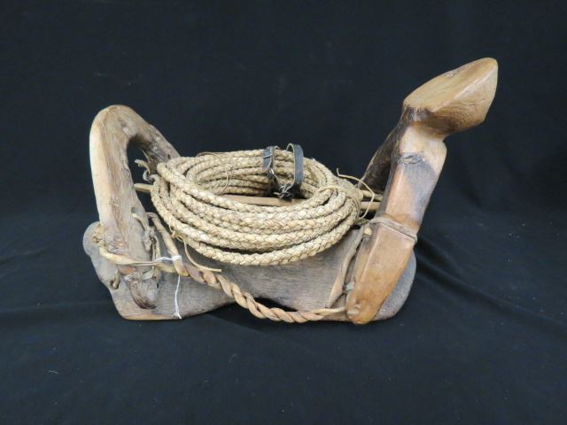 Appraisal: Wooden Saddle carved with whip and spurs unusual great for