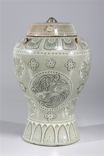 Appraisal: Korean celadon glazed covered jar with elaborate designs of bird