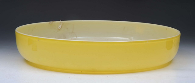 Appraisal: A SHALLOW YELLOW GLASS BOWL with central polished pontil diameter