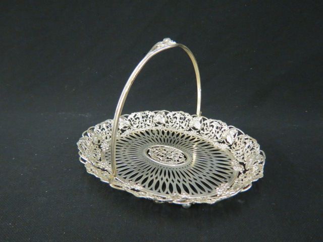 Appraisal: Sterling Silver Basket elaborate openwork with grape vine border cherubs