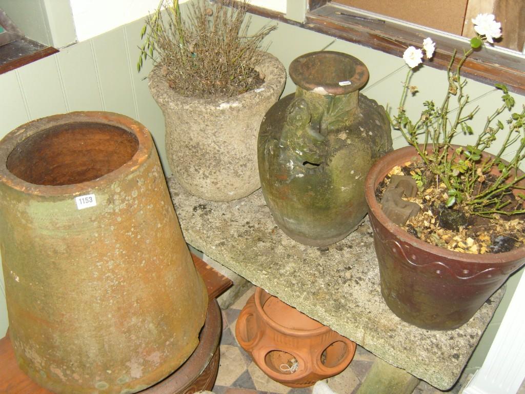 Appraisal: A Victorian terracotta rhubarb forcer together with three planters of