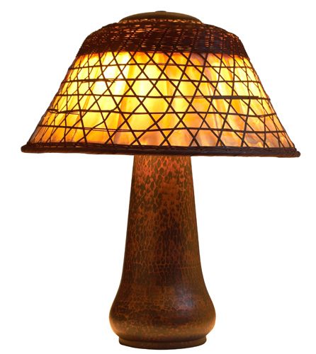 Appraisal: GUSTAV STICKLEY Table lamp with a hammered copper three-socket base