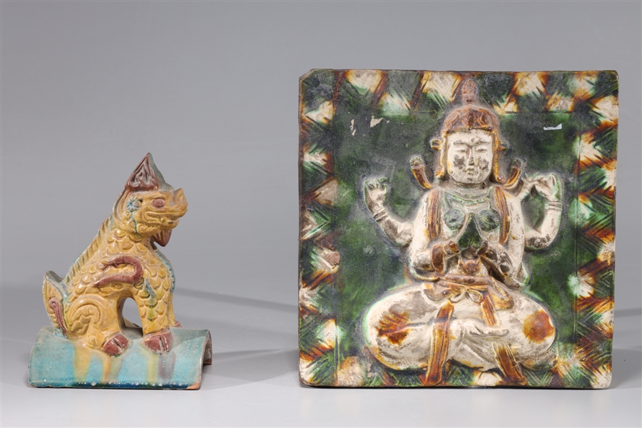 Appraisal: Two antique Chinese glazed pottery roof tiles featuring a multi-armed