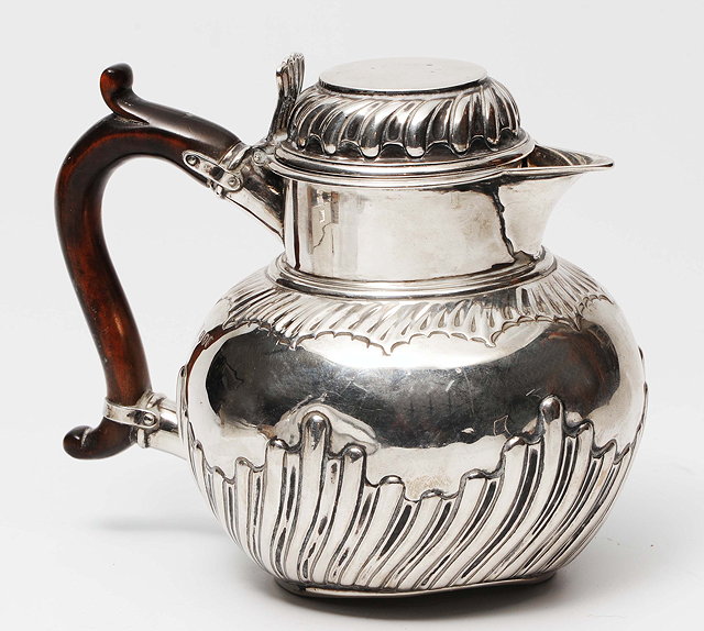 Appraisal: A LATE VICTORIAN SILVER HOT WATER JUG of circular form