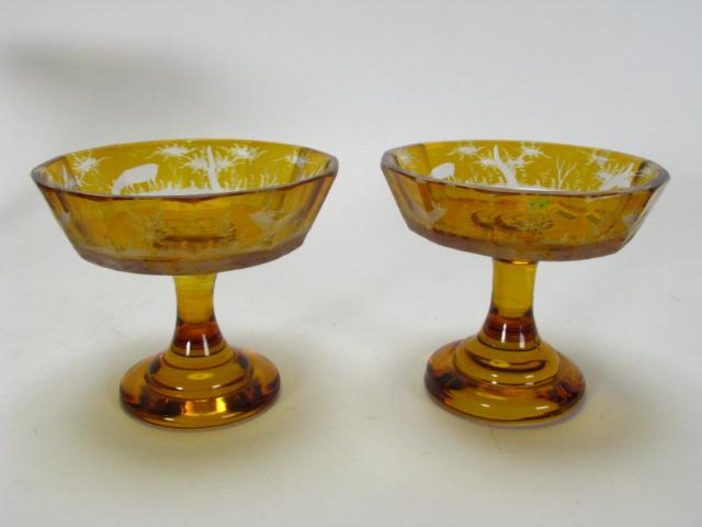 Appraisal: Pair of Amber cut to clear Bohemian glass pedestal compotes