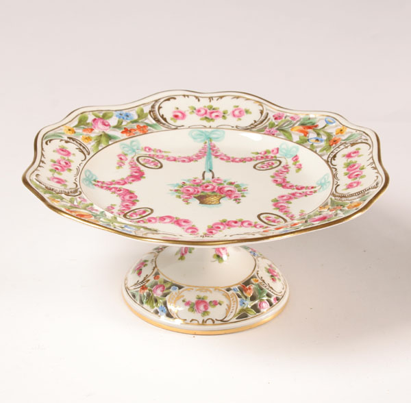 Appraisal: Dresden hand painted porcelain tazza with rose swags Diam Very