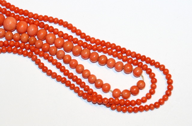 Appraisal: A CORAL BEAD NECKLACE cm long and a further graduated