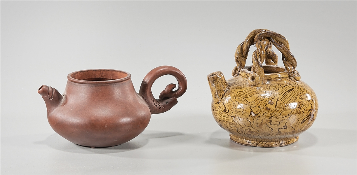 Appraisal: Two Chinese teapots including one Yixing with fish mold to