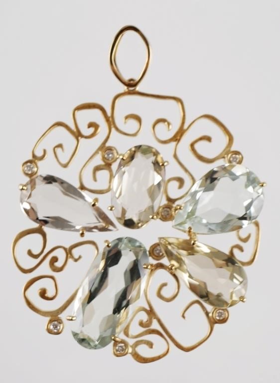 Appraisal: K yellow gold pendant containing quartz stones oval and pear