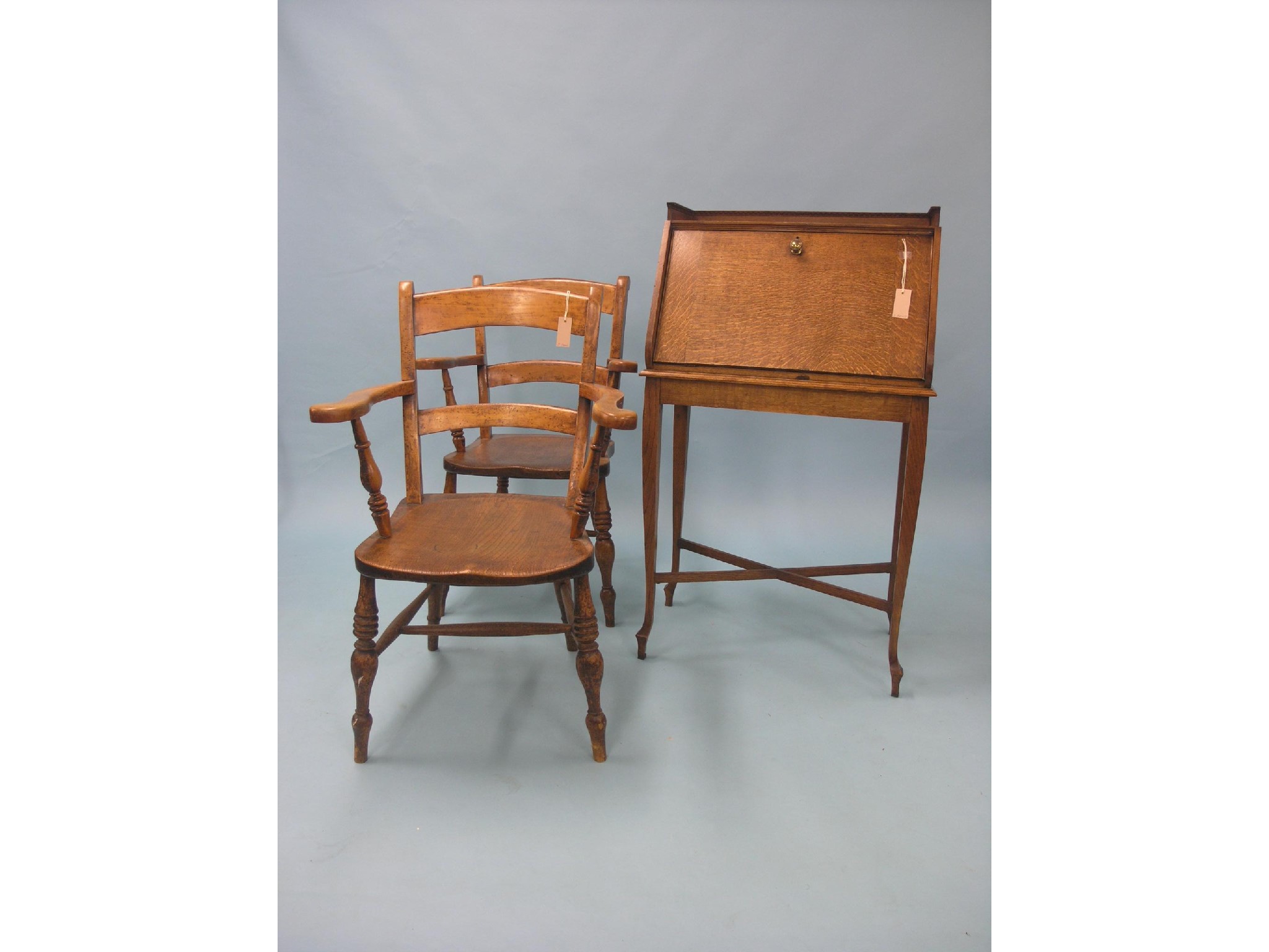 Appraisal: An early th century solid medium oak bureau fall-front enclosing