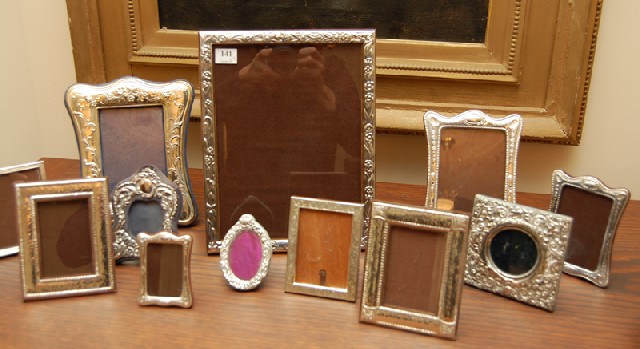 Appraisal: A COLLECTION OF TWELVE STERLING SILVER PICTURE FRAMES