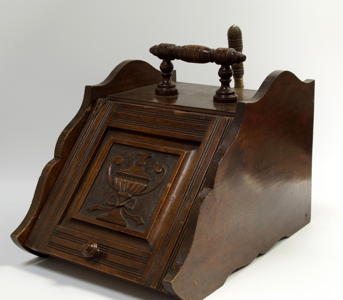 Appraisal: A Victorian mahogany coal scuttle with turned wooden handle and