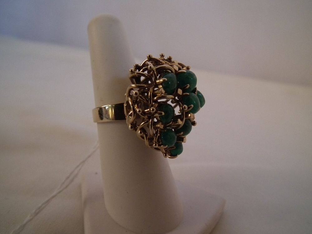 Appraisal: K GOLD EMERALDS RING K gold cocktail bird's nest ring