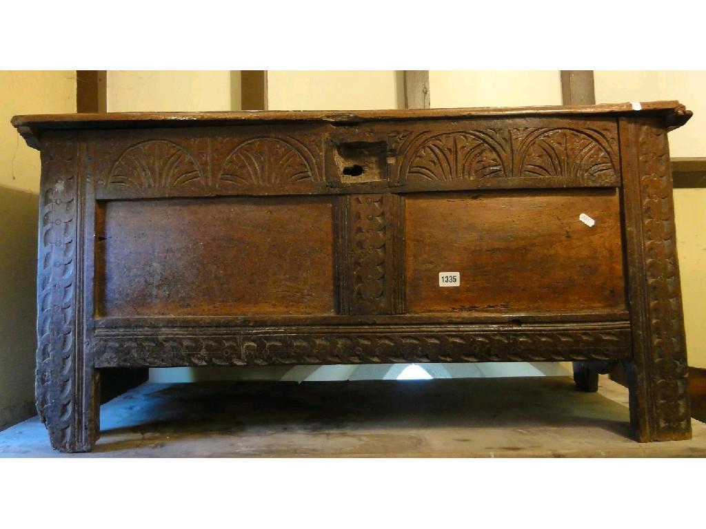 Appraisal: An th century oak coffer the panelled front elevation with