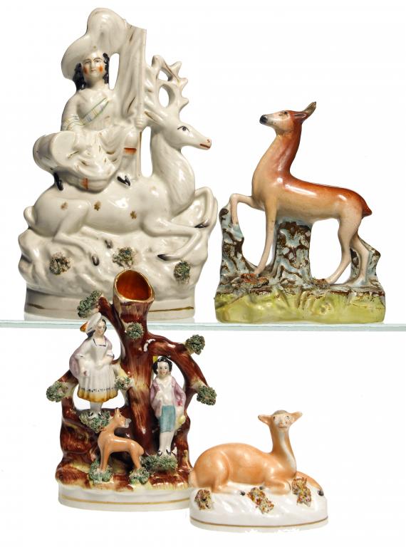 Appraisal: THREE STAFFORDSHIRE EARTHENWARE MODELS OF OR GROUPS WITH DEER AND