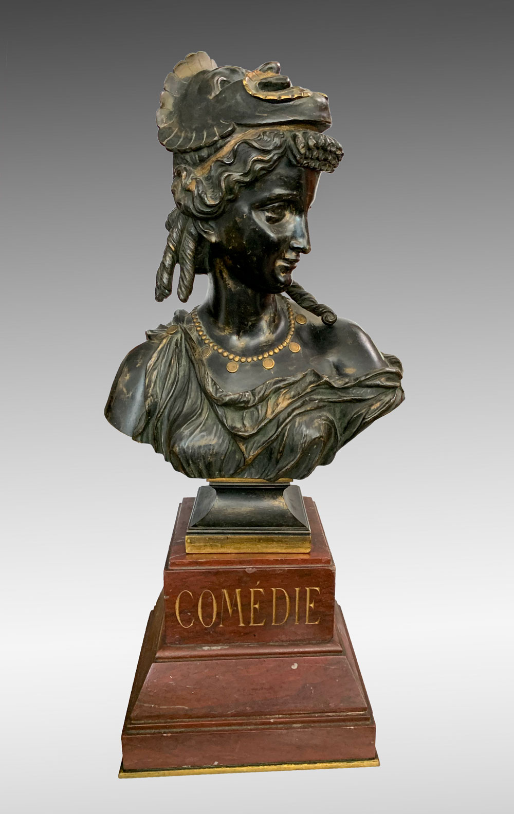 Appraisal: PATINATED BRONZE BUST TITLED ''COMEDIE'' Depicts a Young Female Wearing