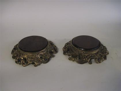 Appraisal: Pair of French gilt bronze standsEach with a circular mahogany