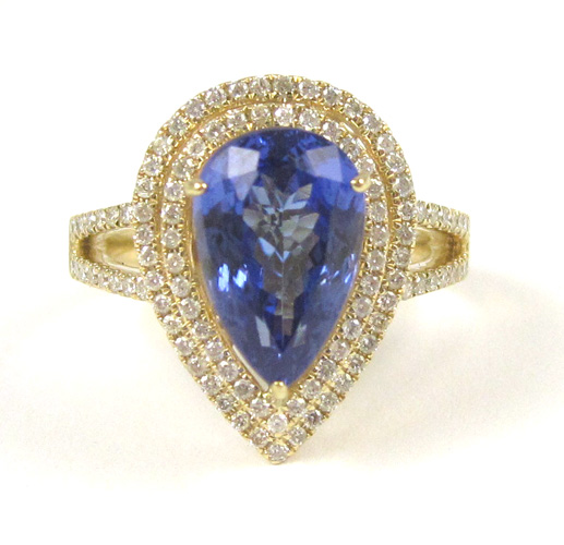 Appraisal: TANZANITE DIAMOND AND FOURTEEN KARAT GOLD RING with round-cut diamonds