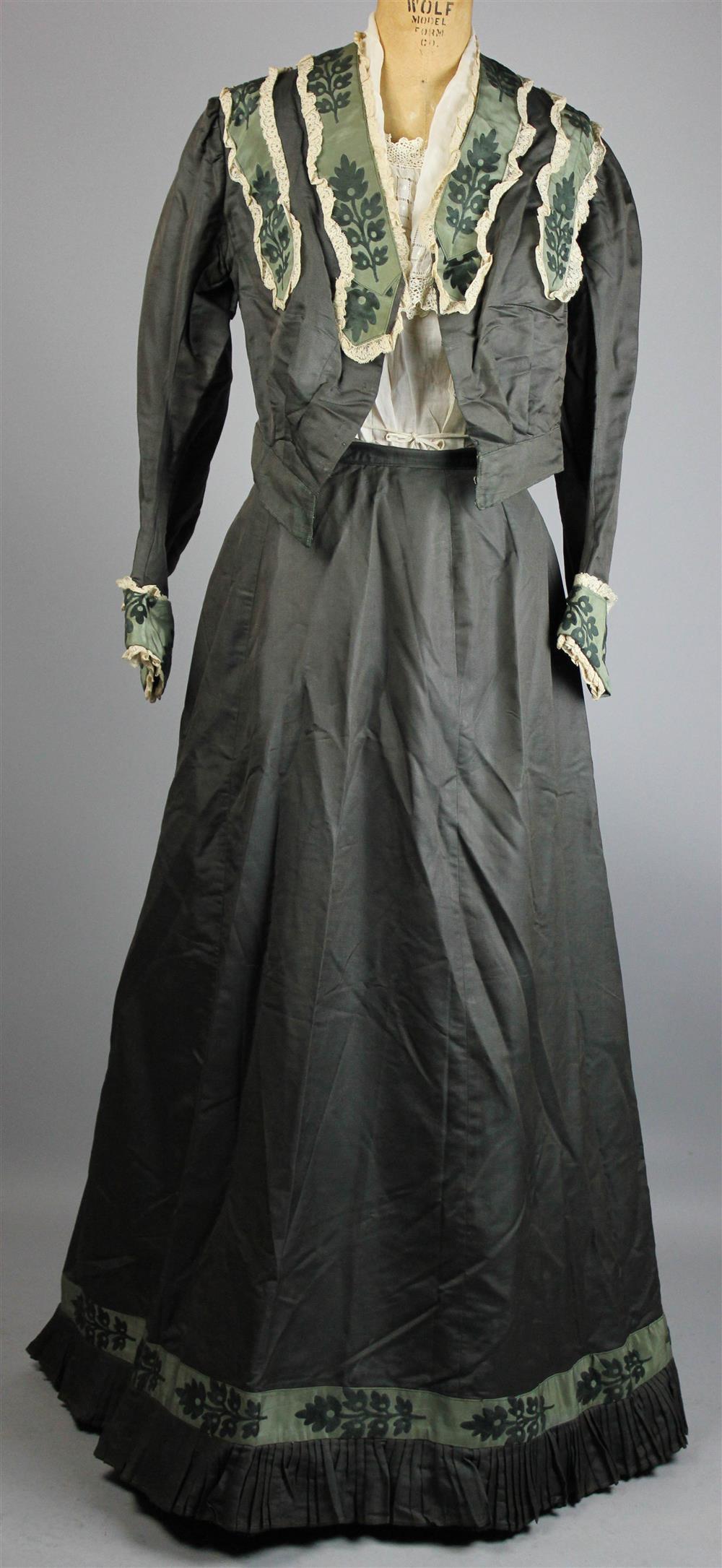 Appraisal: OLIVE GREEN SILK PROMENADE SUIT WITH BLOUSE the bodice and