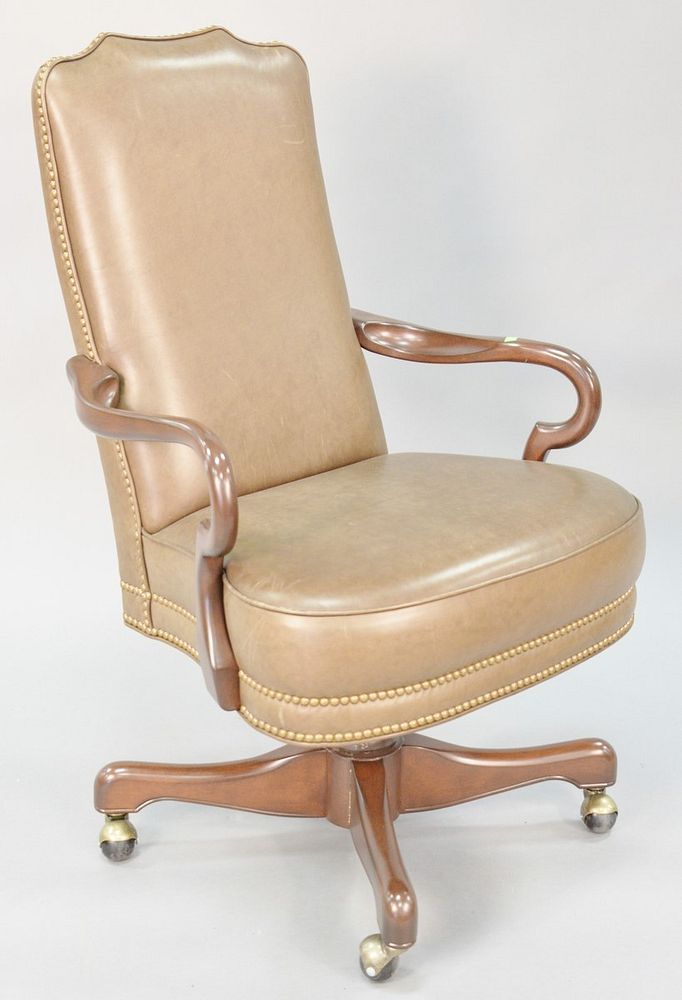 Appraisal: Leather upholstered swivel executive chair h x w Provenance Former