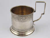 Appraisal: A Russian silver tea glass holder with beaded rim maker