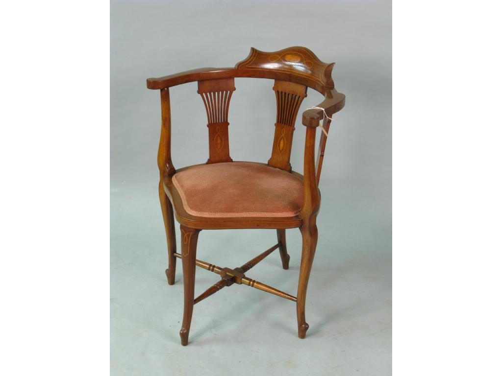 Appraisal: An Edwardian inlaid mahogany corner armchair with pierced slat-back and