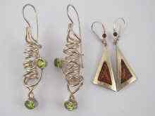 Appraisal: A pair of white metal tests silver peridot earrings and