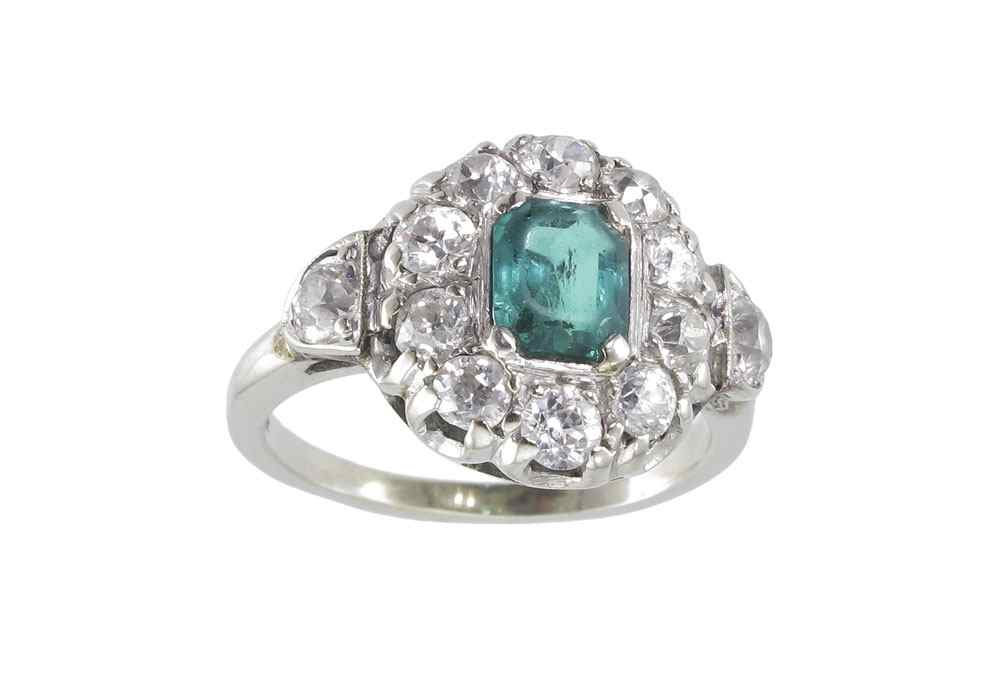 Appraisal: EMERALD DIAMOND RING K white gold ring contains one emerald