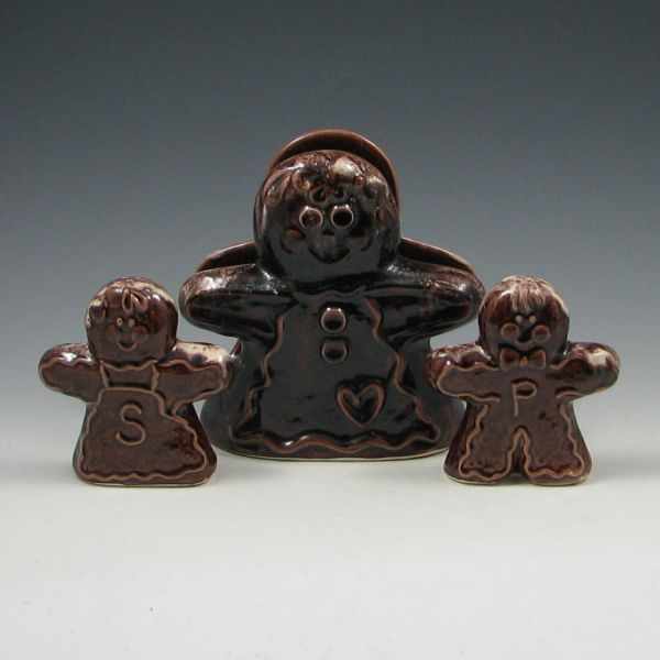 Appraisal: Commemorative gingerbread man and woman napkin holder and salt and