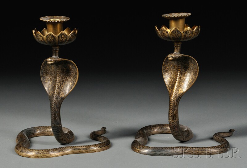 Appraisal: Pair of Persian Brass and Niello Snake-form Candlesticks each cast